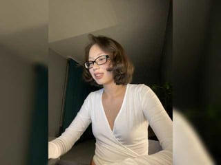 adadollll brunette cam girl with shaved pussy doesn't spare her booty