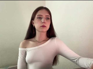 nextdoorkiora european cam babe offers her shaved pussy for live sex experiments online